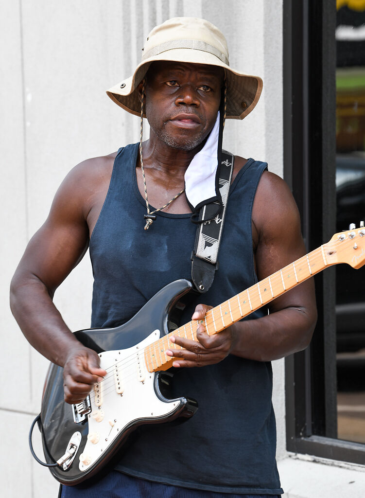 Mike Miller plays electric guitar with Band of Brothers
